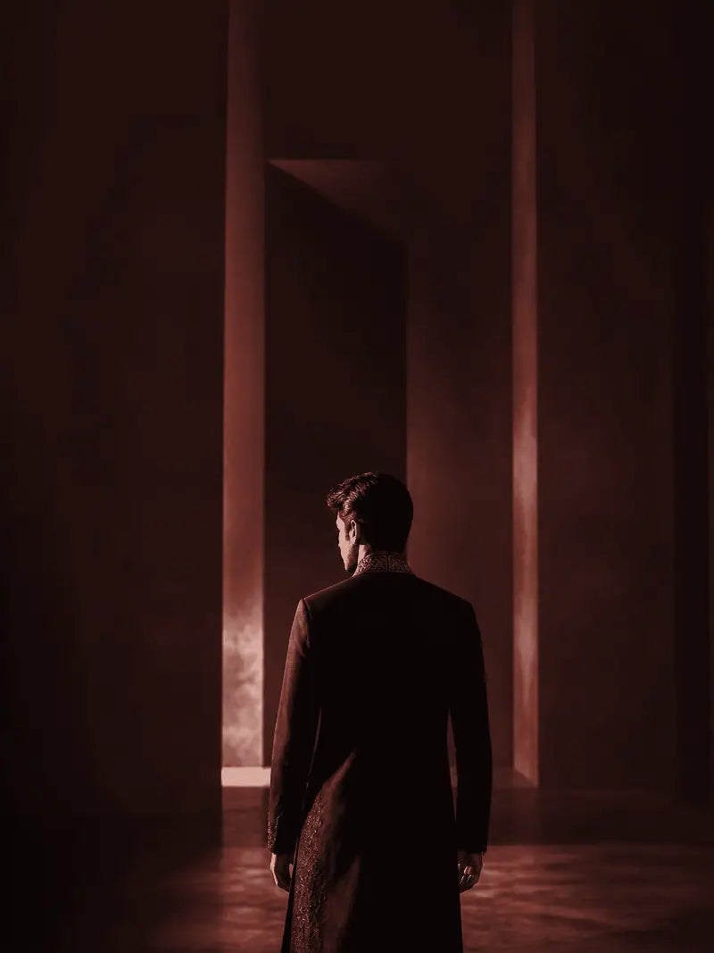 Maroon garment shown from behind in a gallery setting.